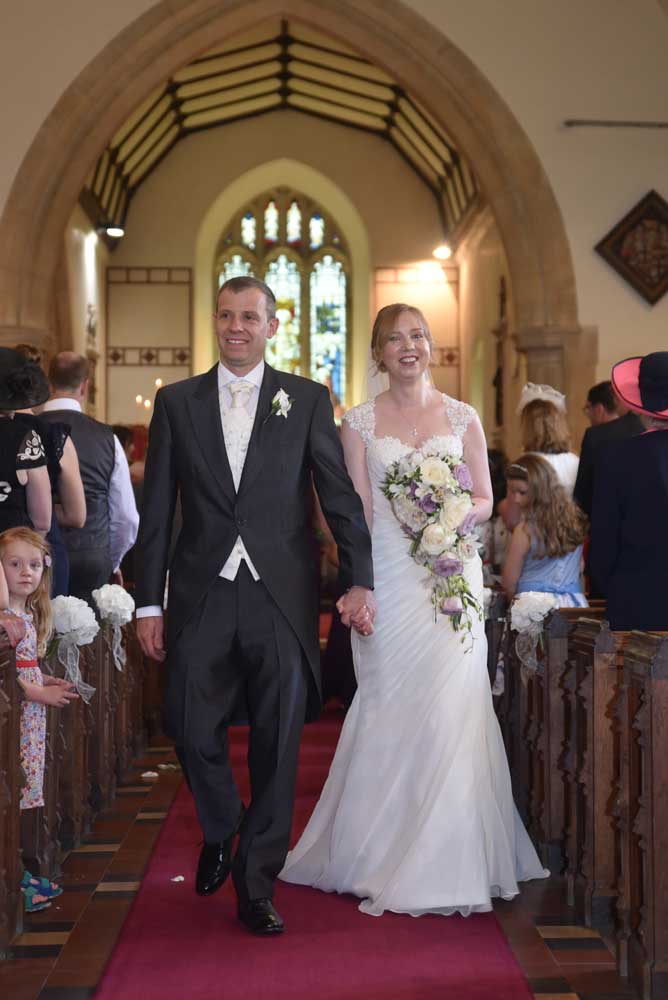 Walking Down the Isle by The Wedding Photo Company