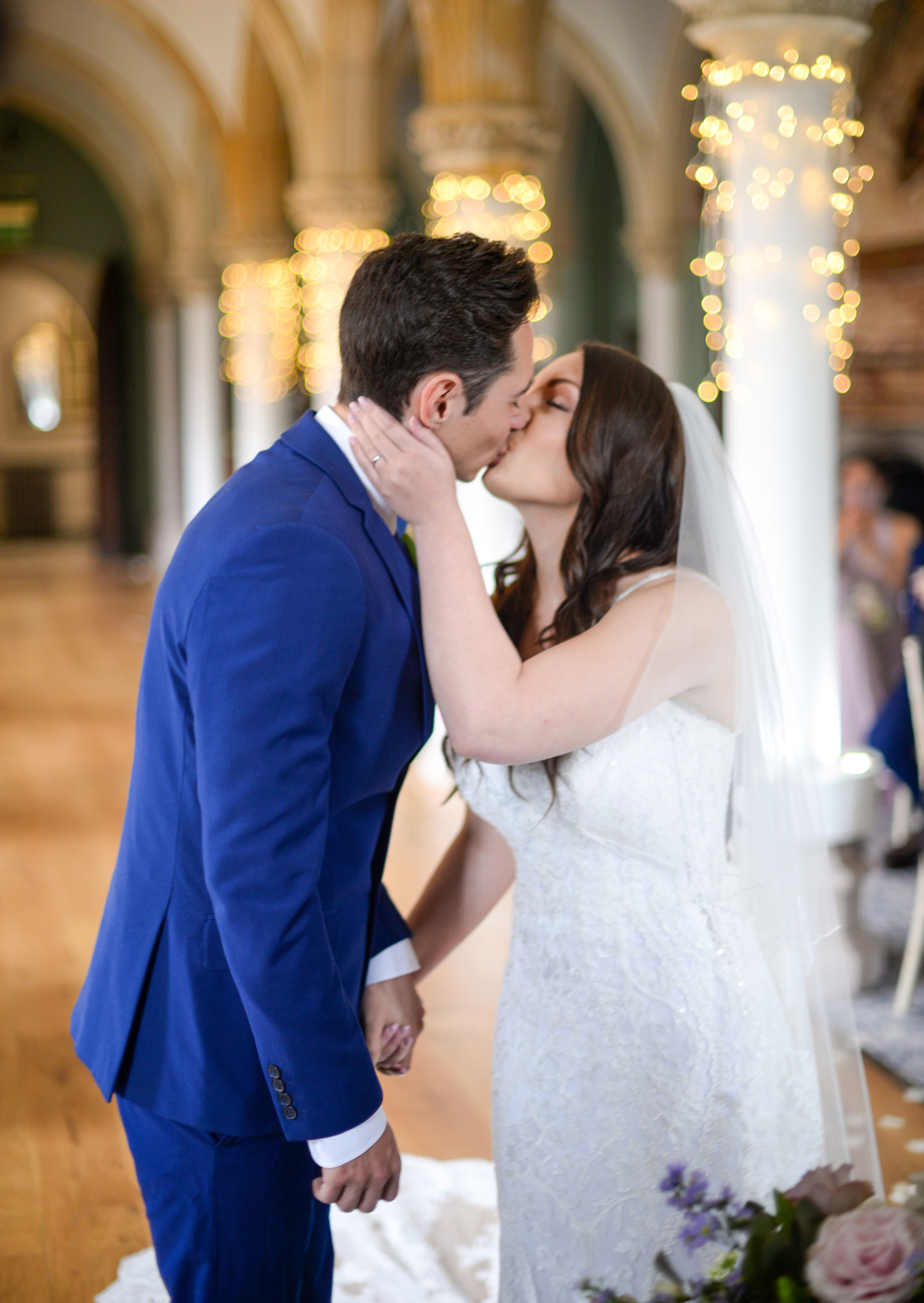 Bride and Groom kissing in Ceremony at Wedding Photo Wotton House